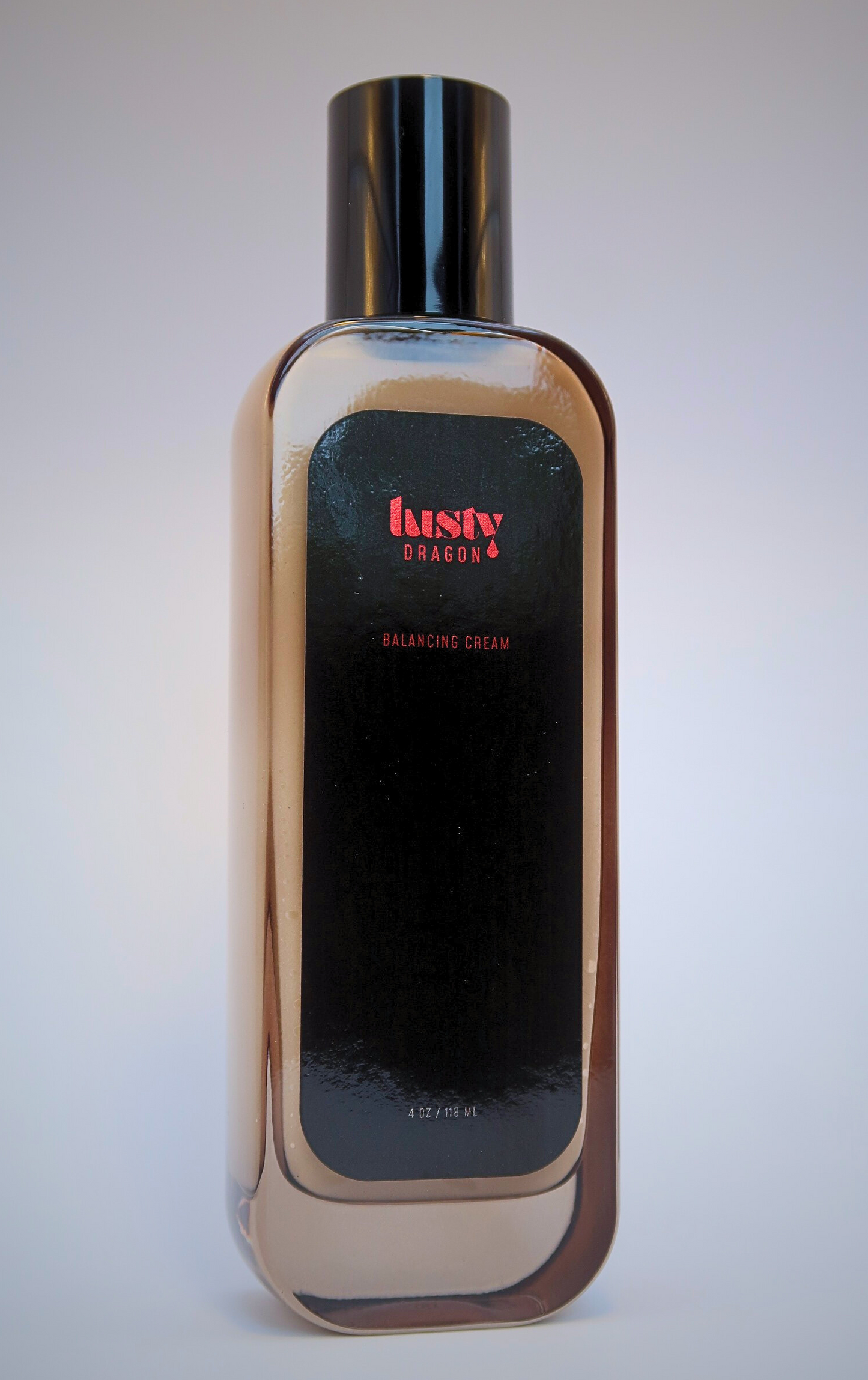 Front view of Lusty Dragon Balancing Cream bottle — 4 oz vegan tattoo skincare for healing and soothing skin
